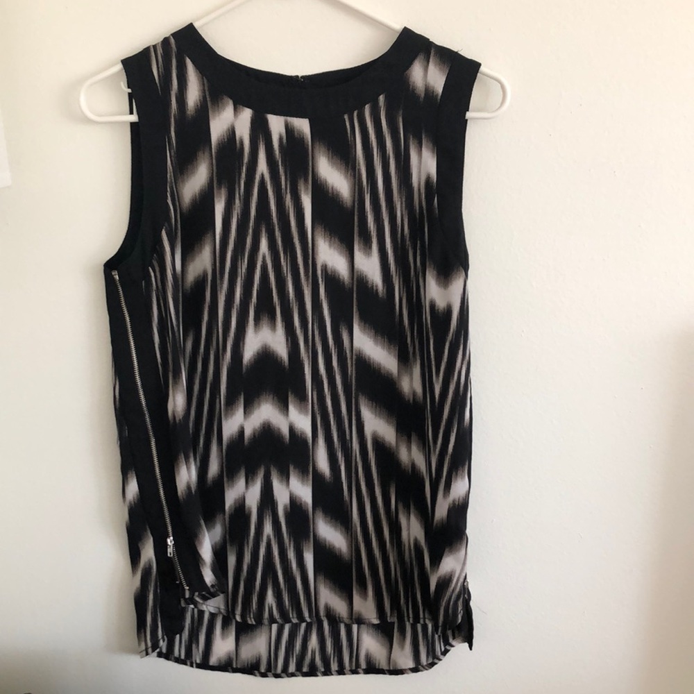 Black and white sleeveless blouse